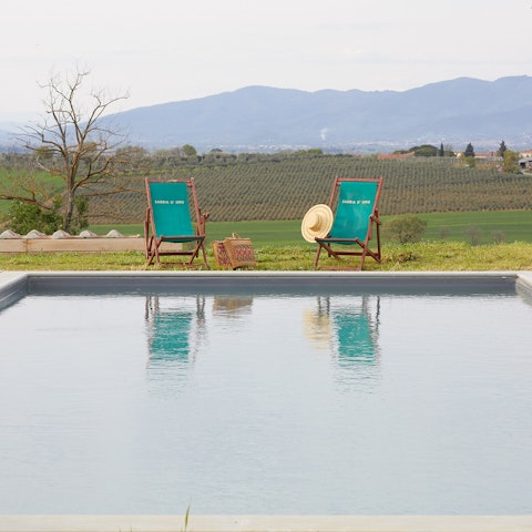 Admire the rolling Tuscan hills from the comfort of the poolside