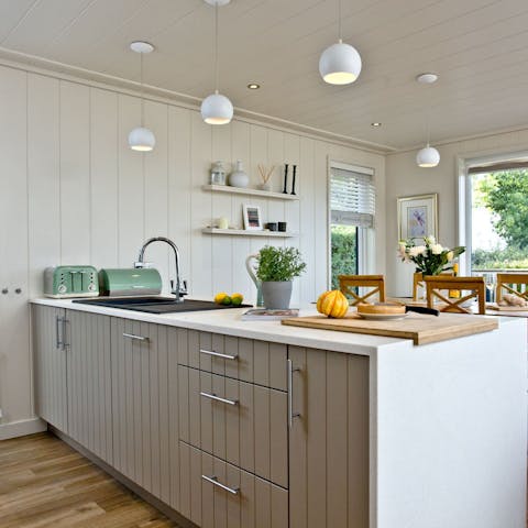 Cook and eat together in the bright, open-plan space