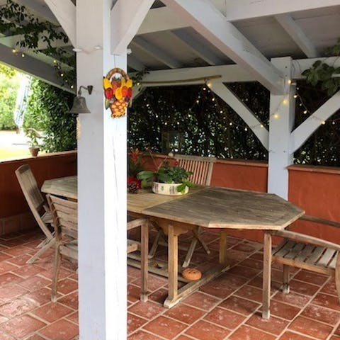 Sip wine underneath the fairy light-strewn canopy