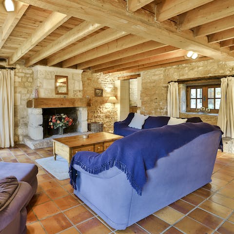 Cosy up in front of the stone fireplace for a family movie night