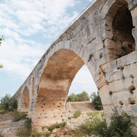 Visit 'Pont Julien', the Roman stone arch bridge in nearby Bonnieux