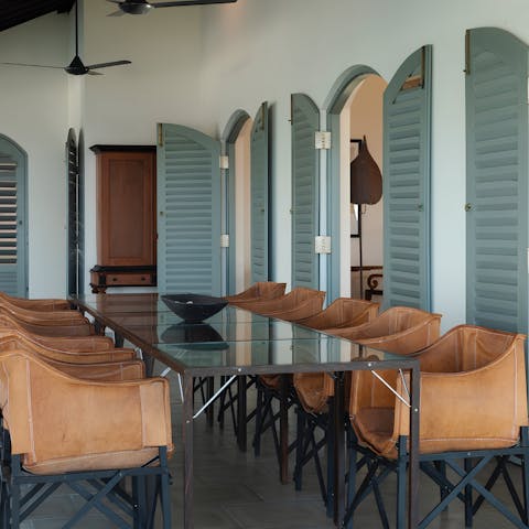 Enjoy a meal cooked by the villa's chef, at the alfresco dining table