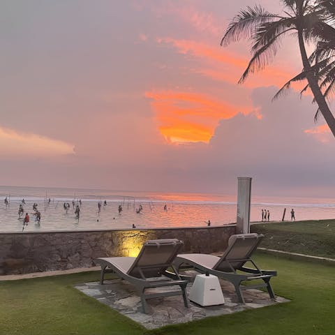 Watch the fishermen as the sun sets over the sea