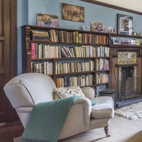 Pull out a book from one of the many bookcases