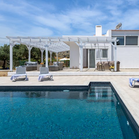 While away sunny days taking dips in the private pool and soaking up some rays on the loungers