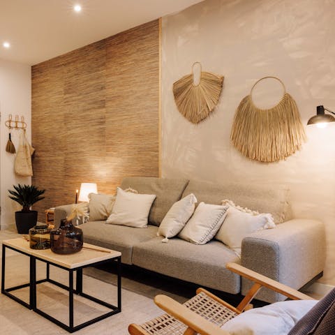 Kick back in the boho-chic living room with a glass of wine after a day of exploring