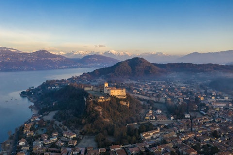 Discover medieval hilltop fortresses commanding sweeping Lake Como panoramas