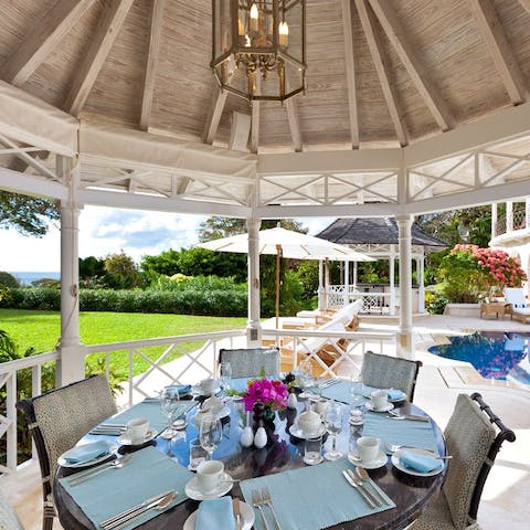 Dine on Bajan delicacies under the shade of the pavilion