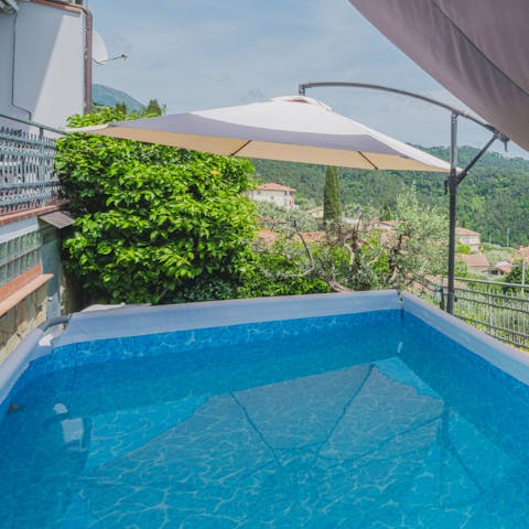 Plunge into the above-ground pool for a quick dip