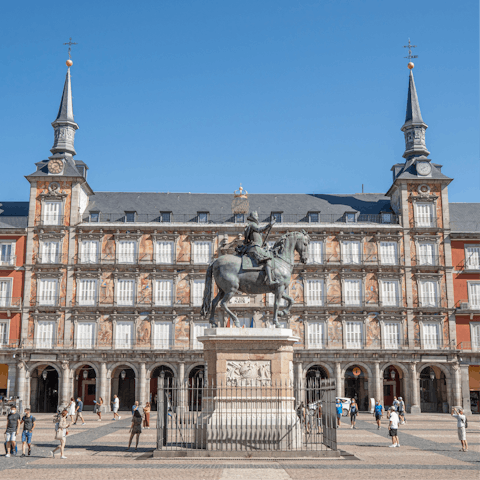 Hop on a bus to the bustling Plaza Mayor, with its restaurants and bars