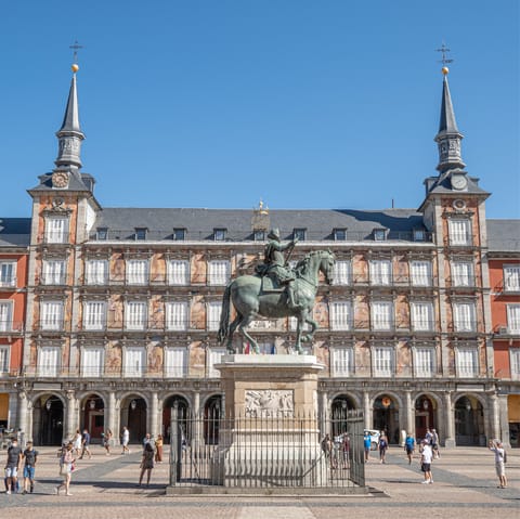Hop on a bus to the bustling Plaza Mayor, with its restaurants and bars