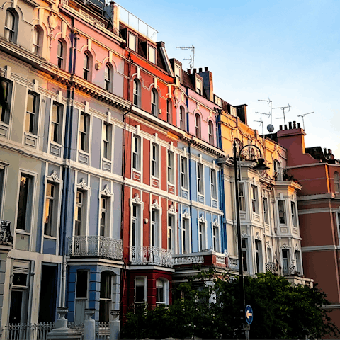 Check out the colourful streets of Notting Hill, located close by