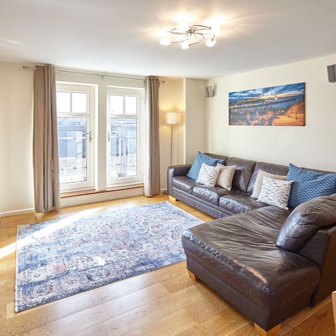 Step onto the balcony directly from the sofa to enjoy a coffee