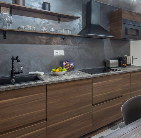 Cook up a home-made dinner paired with some local French wine in the sleek kitchen