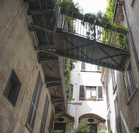 Stroll through the classically Milanese courtyard to start your day