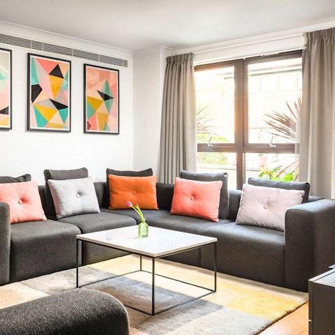 Toast the day's end with drinks in the light-filled living room