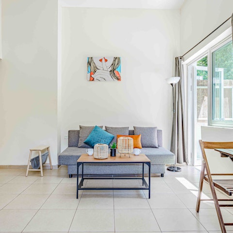 Kick back in the bright living area with a cold drink after a day of exploring the city