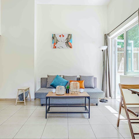 Kick back in the bright living area with a cold drink after a day of exploring the city