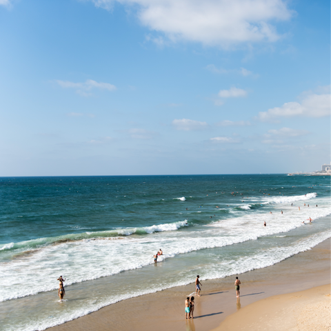 Sink your toes in the sand at Gordon Beach, within easy walking distance