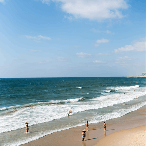 Sink your toes in the sand at Gordon Beach, within easy walking distance