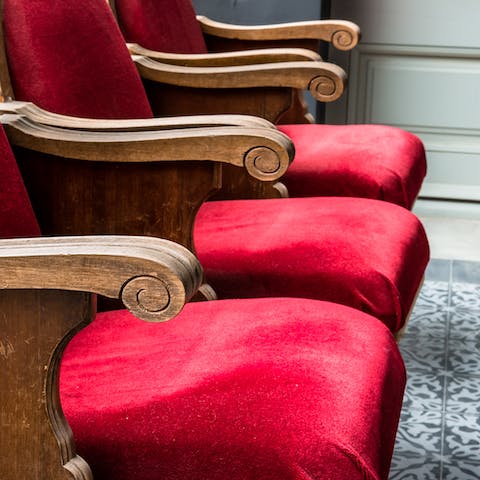 Take a seat on the plush velvet chairs on the balcony