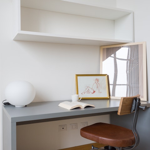 Write postcards or check your inbox at the desk in the corner