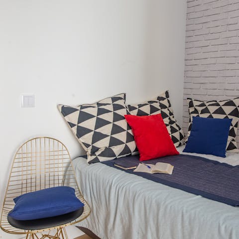 Find a cosy spot to read on the gold finish wire chair