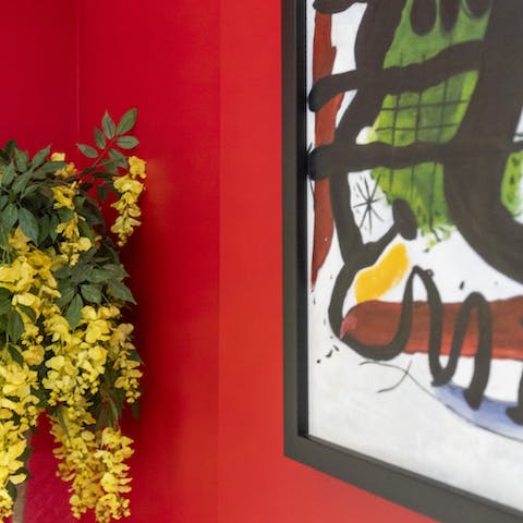 Take in the vibrant colours and abstract artwork around the home