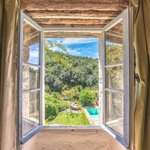 Wake up to forest views from the bedroom