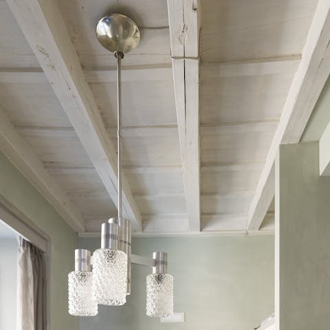 Admire the traditional painted wooden beams on the ceiling