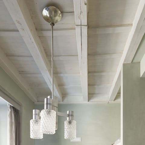 Admire the traditional painted wooden beams on the ceiling
