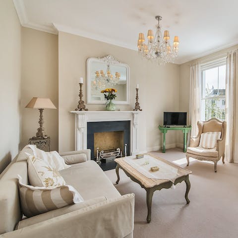 Settle in for a cosy evening by the fire in the grand living room