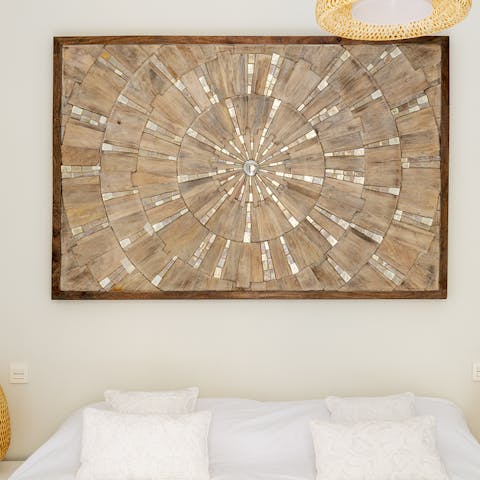 Gaze into the unique wooden artwork in the master bedroom