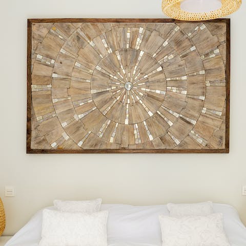 Gaze into the unique wooden artwork in the master bedroom