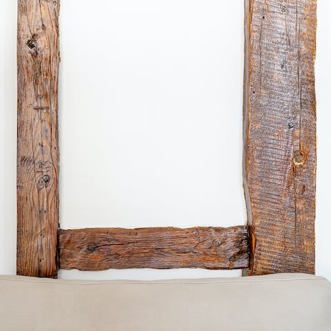 Admire the craftsmanship of the original wooden beams in the hallways