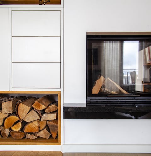 Relax in front of the cosy fireplace