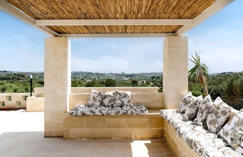 Relax on the terrace with a glass of Itay's finest wine