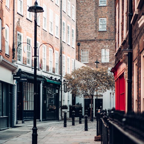 Head to the bars and restaurants of Soho, a ten-minute walk from this home