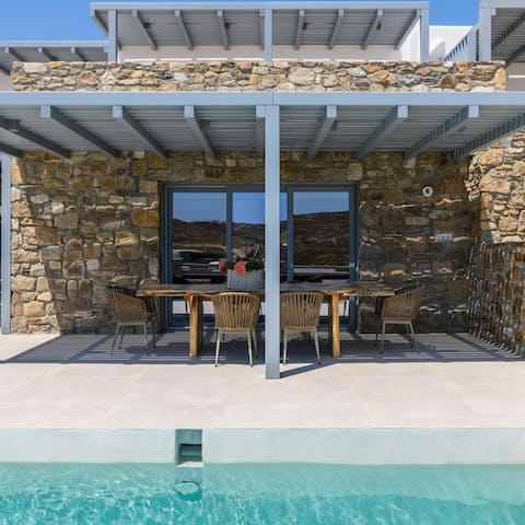 Enjoy alfresco dining by the private pool under the sun