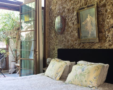 Admire rustic touches like the exposed limestone wall