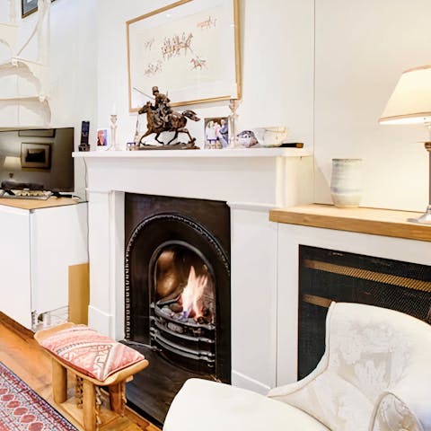 Get cosy by the warmth of the fireplace and snuggle up with a good book