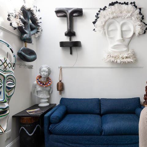 Admire your artist host's inspirational African wall sculptures