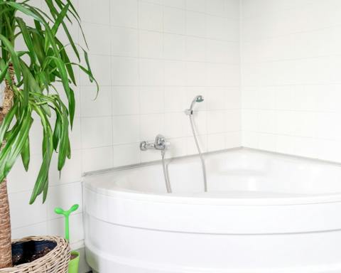 Treat yourself to a long soak in the corner bathtub