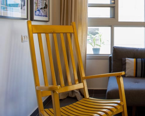 The sunshine yellow rocking chair
