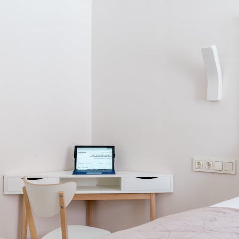 Catch up on work at the cute corner desk in the master bedroom