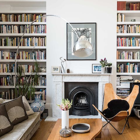 Sit in the butterfly chair under the Arco lamp with a book in-hand