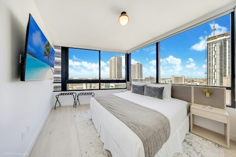 Wake up to city views from wrap-around windows