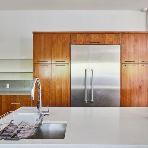 Immaculate wooden and steel kitchen finishes