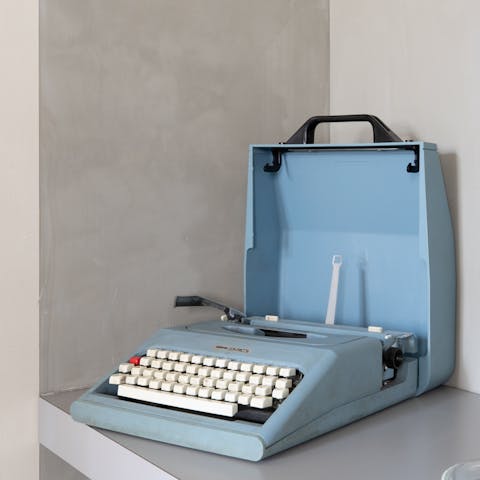 Admire the powder blue vintage typewriter