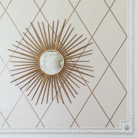 The gold-framed mirror